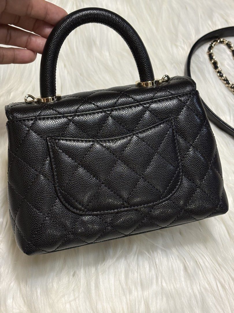 CC Coco Black Caviar Leather Mini Handle Flap Bag (Category: Luxury Bags & Wallets) located in Mandaue City. Submitted by jane2872 (Listing ID 1470058972, Image 3). Description: - Premium black caviar leather with classic quilted diamond pattern - Luxurious silver-tone hardware featuring iconic CC turn-lock closure - Convenient back slip pocket and protective base feet - Includes a detachable leather and chain interwoven strap - Compact everyday 
