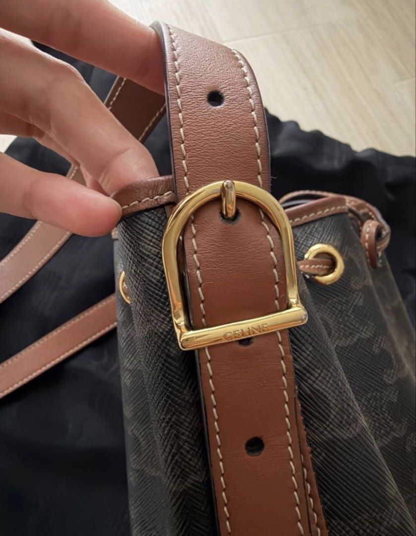 Celine Drawstring Bag Small (Category: Luxury Bags & Wallets) located in Las Pinas. Submitted by nihonluxxe88 (Listing ID 1469955967, Image 3). Description: CELINE Small Drawstring Bag in Triomphe Canvas & Calfskin 14.5 X 21 X 14 CM Triomphe canvas, calfskin trim Textile lining Cross-body and shoulder carry Leather drawstring closure - Brand: CELINE - Type: Shoulder bag - Material: Leather - Color: Dark brown - Design: Bucket bag - Hardware: Gold