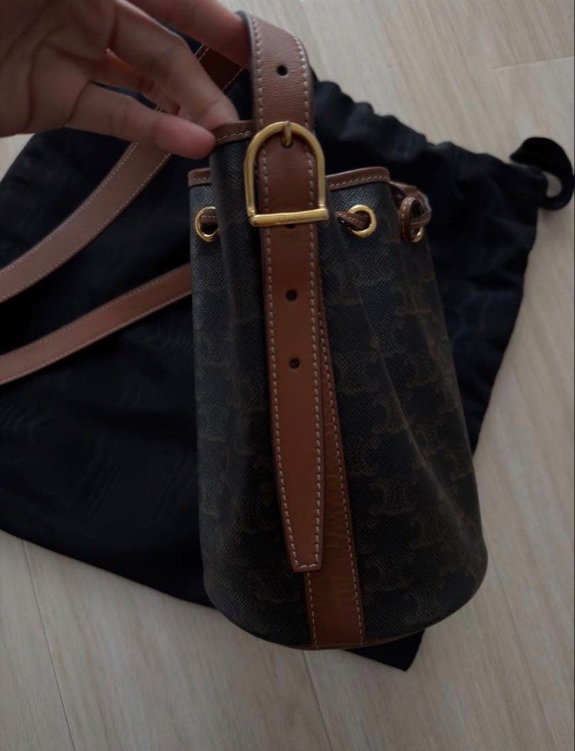Celine Drawstring Bag Small (Category: Luxury Bags & Wallets) located in Las Pinas. Submitted by nihonluxxe88 (Listing ID 1469955967, Image 2). Description: CELINE Small Drawstring Bag in Triomphe Canvas & Calfskin 14.5 X 21 X 14 CM Triomphe canvas, calfskin trim Textile lining Cross-body and shoulder carry Leather drawstring closure - Brand: CELINE - Type: Shoulder bag - Material: Leather - Color: Dark brown - Design: Bucket bag - Hardware: Gold