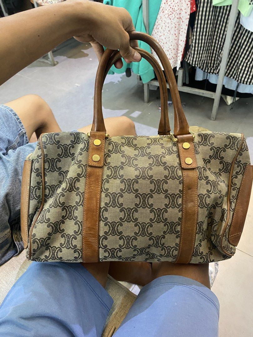 Celine Macadam Monogram Boston Handbag Brown Canvas Leather (Category: Luxury Bags & Wallets) located in Manila. Submitted by 5treetw3ar (Listing ID 1470003506, Image 1). Description: - Authentic vintage Celine Boston bag - Classic brown Macadam monogram canvas with brown leather trim and dual top handles - Features a secure zip top closure and hanging clochette charm - Roomy interior, perfect for everyday use - Condition note: Shows noticeable w