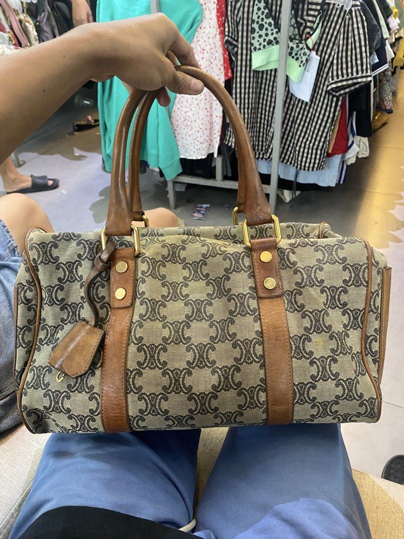 Celine Macadam Monogram Boston Handbag Brown Canvas Leather (Category: Luxury Bags & Wallets) located in Manila. Submitted by 5treetw3ar (Listing ID 1470003506, Image 2). Description: - Authentic vintage Celine Boston bag - Classic brown Macadam monogram canvas with brown leather trim and dual top handles - Features a secure zip top closure and hanging clochette charm - Roomy interior, perfect for everyday use - Condition note: Shows noticeable w