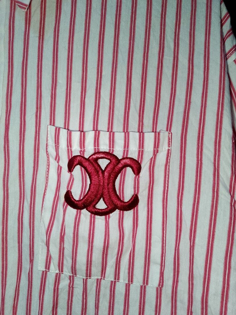 Celine Red White Striped Button Up Shirt (Category: Shirts) located in Manila. Submitted by mjthrifted_second (Listing ID 1469970257, Image 3). Description: - Brand: Celine Paris -Dimes: 22/27 - Design: Red and white stripes with classic collar - Details: Long sleeves with embroidered Celine lettering on cuffs, chest pocket with red embroidered Celine logo - Hardware: Gold-toned front buttons - Condition: Excellent pre-loved condition - Perfect f