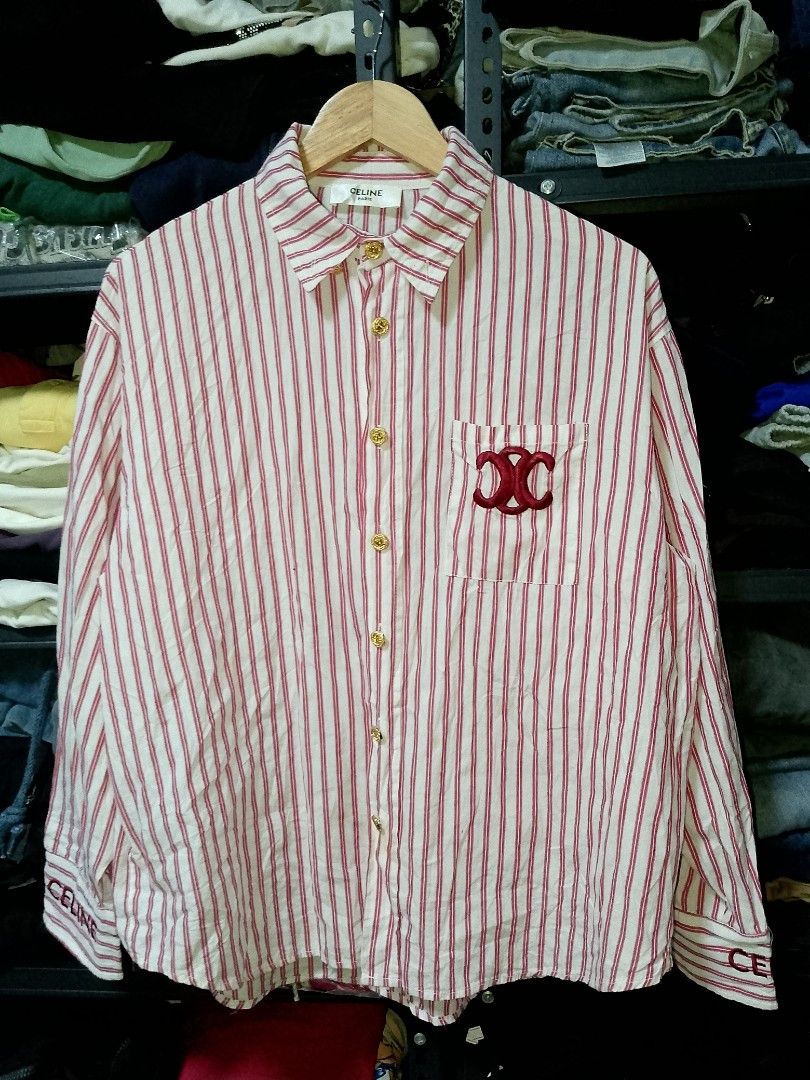 Celine Red White Striped Button Up Shirt (Category: Shirts) located in Manila. Submitted by mjthrifted_second (Listing ID 1469970257, Image 1). Description: - Brand: Celine Paris -Dimes: 22/27 - Design: Red and white stripes with classic collar - Details: Long sleeves with embroidered Celine lettering on cuffs, chest pocket with red embroidered Celine logo - Hardware: Gold-toned front buttons - Condition: Excellent pre-loved condition - Perfect f