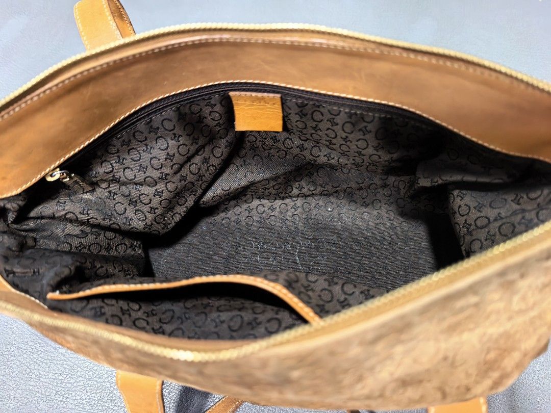 Celine Suede C Initial Pattern Tote Bag Brown Tan (Category: Luxury Bags & Wallets) located in Cagayan de Oro. Submitted by pootx (Listing ID 1470091816, Image 3). Description: -please check the last photo sa issues - Authentic Celine tote bag made in Italy (Serial No: MC00/1) - Brown suede body with signature C monogram pattern and tan leather trim - Dual top handles and protective metal feet on the bottom - Secure top zip closure with branded g