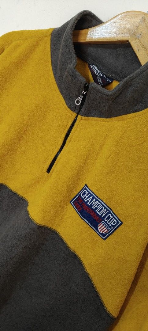 Champion Cup Quarter Zip Fleece Pullover Yellow Grey L (Category: Coats, Jackets and Outerwear) located in Bulacan. Submitted by adrian2325 (Listing ID 1470112546, Image 3). Description: - Authentic Champion Cup quarter zip fleece pullover - Stylish yellow and dark grey two-tone colorblock design - Cozy stand collar with 1/4 zip closure - Features embroidered Champion Cup chest patch and sleeve logo - Super soft fleece fabric inside and out for m