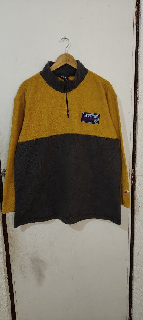 Champion Cup Quarter Zip Fleece Pullover Yellow Grey L (Category: Coats, Jackets and Outerwear) located in Bulacan. Submitted by adrian2325 (Listing ID 1470112546, Image 1). Description: - Authentic Champion Cup quarter zip fleece pullover - Stylish yellow and dark grey two-tone colorblock design - Cozy stand collar with 1/4 zip closure - Features embroidered Champion Cup chest patch and sleeve logo - Super soft fleece fabric inside and out for m