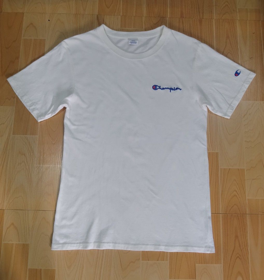 Champion White Script Logo T-Shirt Size Small (Category: Shirts) located in San Jose del Monte. Submitted by azetor (Listing ID 1469986180, Image 1). Description: - Brand/Style: Authentic Champion white t-shirt - Design: Classic embroidered script logo on chest and iconic C logo patch on left sleeve - Details: Crew neckline, short sleeves - Material: Comfortable cotton - Condition: Great basic tee, easy to style for casual daily outfits - size Sm