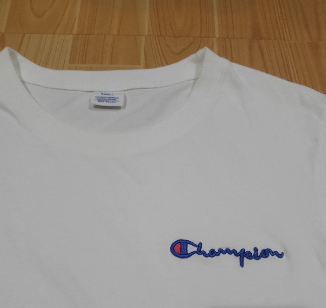 Champion White Script Logo T-Shirt Size Small (Category: Shirts) located in San Jose del Monte. Submitted by azetor (Listing ID 1469986180, Image 3). Description: - Brand/Style: Authentic Champion white t-shirt - Design: Classic embroidered script logo on chest and iconic C logo patch on left sleeve - Details: Crew neckline, short sleeves - Material: Comfortable cotton - Condition: Great basic tee, easy to style for casual daily outfits - size Sm