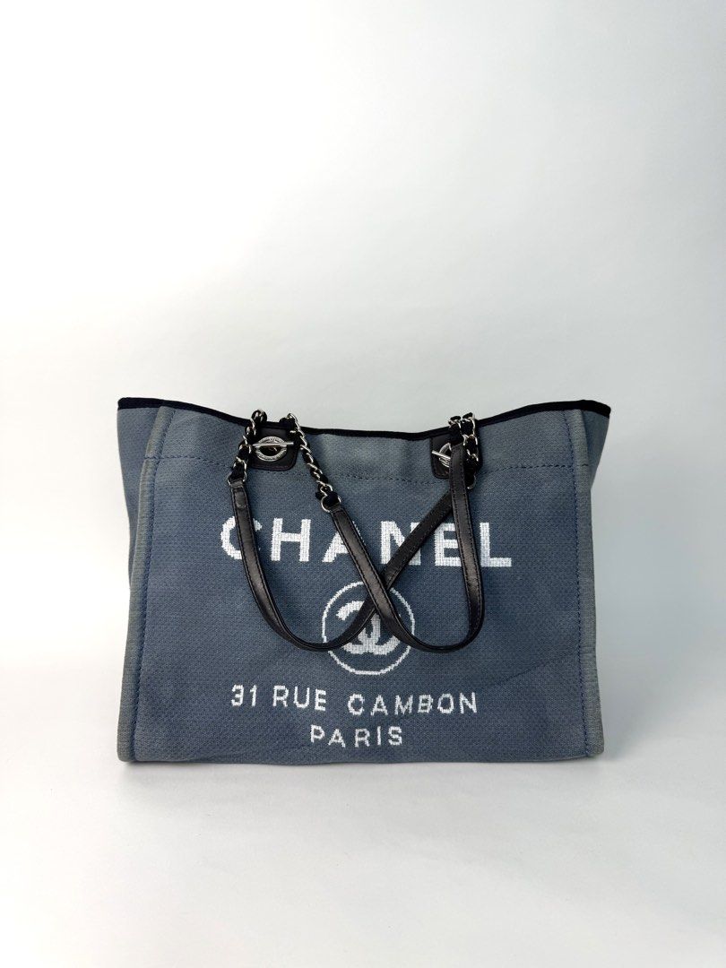Chanel (Category: Luxury Bags & Wallets) located in Angeles City. Submitted by secondluxph (Listing ID 1470096950, Image 3). Description: CHANEL DEAUVILLE CANVAS TOTE BAG WOVEN CANVAS FABRIC DUAL INTERWOVEN CHAIN AND FABRIC SHOULDER STRAP CAN FIT YOUR IPAD, NOTEBOOKS Condition: Very Good / Gently Used Notable Signs of Wear: • Exterior Canvas: Overall excellent and clean with minor, normal signs of gentle use. • Leather & Straps: The leather top h