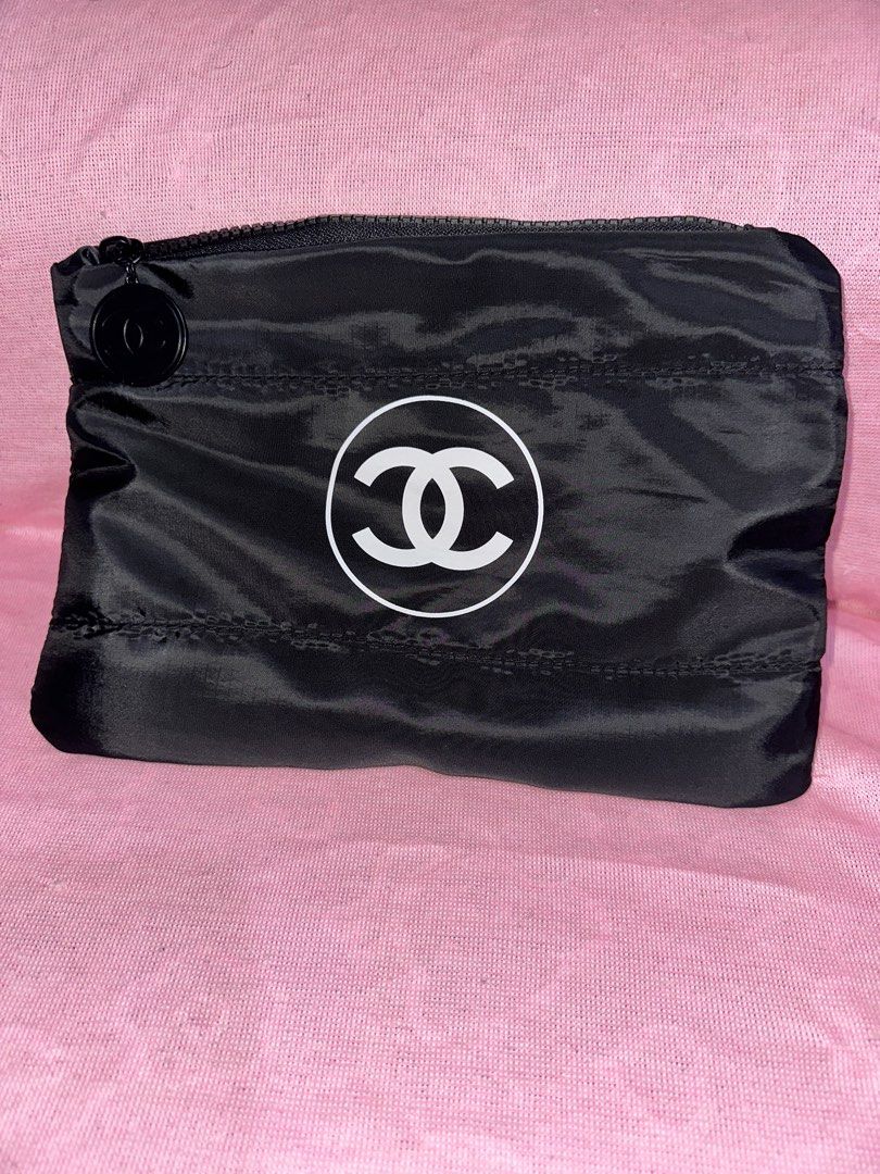 Chanel Black Nylon Pouch with CC Logo (Category: Luxury Bags & Wallets) located in Manila. Submitted by edgiedge (Listing ID 1470100087, Image 1). Description: black nylon pouch featuring the iconic CC logo and chunky zipper pull. Includes an inner zippered pocket and a branded white dust cover bag. ₱500.