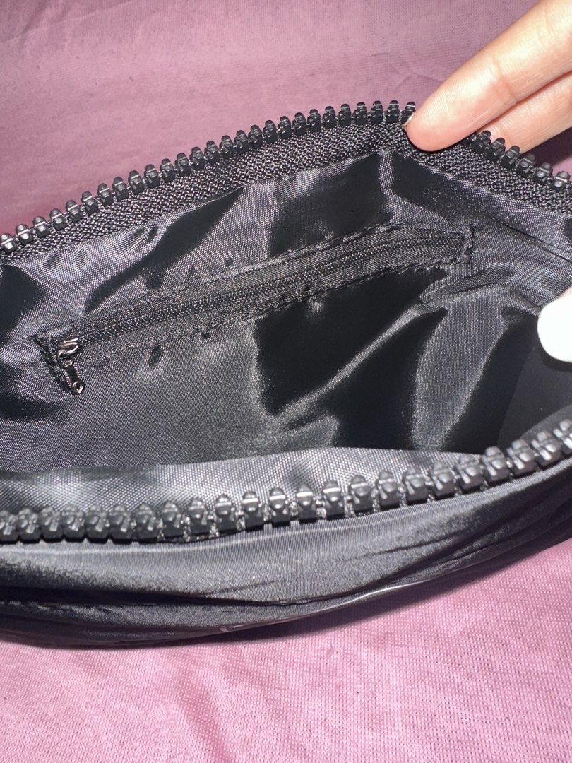Chanel Black Nylon Pouch with CC Logo (Category: Luxury Bags & Wallets) located in Manila. Submitted by edgiedge (Listing ID 1470100087, Image 2). Description: black nylon pouch featuring the iconic CC logo and chunky zipper pull. Includes an inner zippered pocket and a branded white dust cover bag. ₱500.