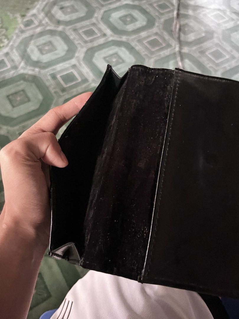 Chanel Black Quilted Long Wallet (Category: Wallets & Card holders) located in Andop. Submitted by outclickz_00 (Listing ID 1469947494, Image 3). Description: - Brand: Chanel - Color: Classic black - Design: Quilted pattern with embossed lettering - Interior: Black fabric lining with multiple card and cash compartments - Condition: Minor wear on the exterior leather surface - Style: Chic and functional long wallet.