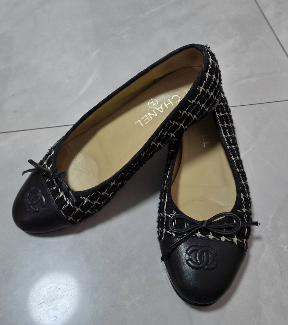 Chanel Black Tweed Cap-Toe Ballet Flats (Category: Flats & Sandals) located in Caloocan City. Submitted by imladris1016 (Listing ID 1469983696, Image 1). Description: - Brand: Chanel - Style: Slip-on flats - Material: Black tweed with checkered pattern and black leather cap toe - Details: Embossed CC logo on toe, small front bow, tan leather inner lining - Condition: Outer soles are clean; shows minor creasing on the footbed from previous gentle 