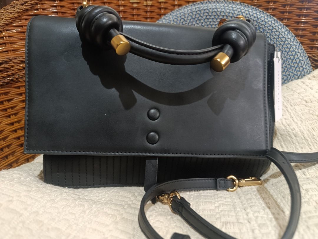 Charles & Keith Black Top Handle Crossbody Bag (Category: Cross-body Bags) located in Malolos. Submitted by vintagefat (Listing ID 1469964025, Image 2). Description: - Brand: Charles & Keith - Color: Classic Black with elegant Gold hardware - Versatile design: Includes a top handle and a detachable strap - Stylish details: Textured vertical stitching panel under the front flap - Secure & Accessible: Magnetic button closure and an exterior back po