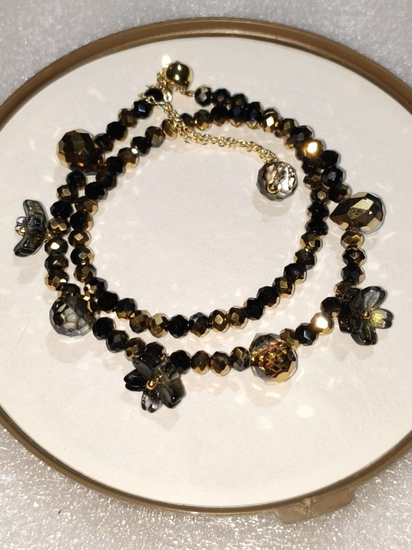 Charming Crystal Beaded Bracelets with Floral Charms (Category: Bracelets) located in Caloocan City. Submitted by books_and_beads (Listing ID 1470083279, Image 2). Description: - Beaded bracelets featuring faceted crystals and floral charms - Includes a gold-tone chain extension with a dangling crystal accent - Adjustable fit for comfortable wear - Available in 4 gorgeous colorways: champagne gold, black, dark multi, and iridescent crystal: · Top