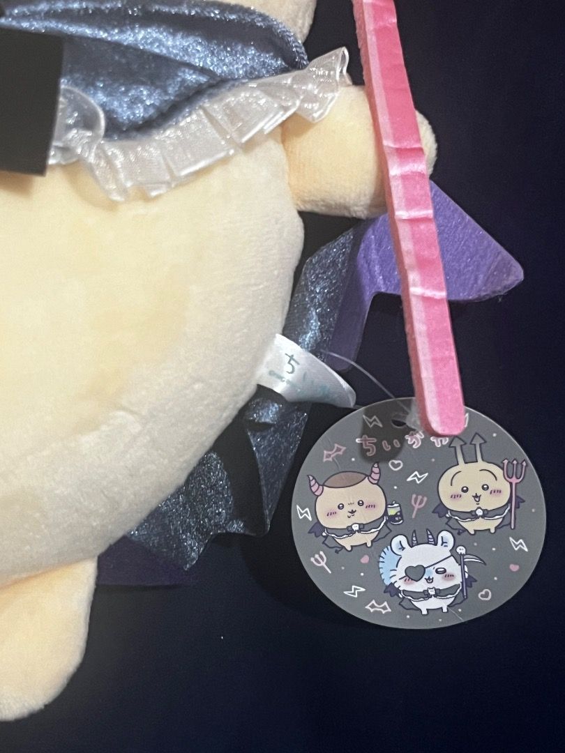 Chiikawa Usagi Halloween Devil Plush (Category: Plushies & Soft Toys) located in Tarlac. Submitted by theoshawott_adventureph (Listing ID 1470124508, Image 3). Description: - Authentic Chiikawa Halloween Series Kurimanju plush - Original tag still attached (Brand New) - Features a black cape, skull-embellished bow, grey horns, and a pink pitchfork - Made with super soft, huggable material - Perfect for gifts or Chiikawa collectors.