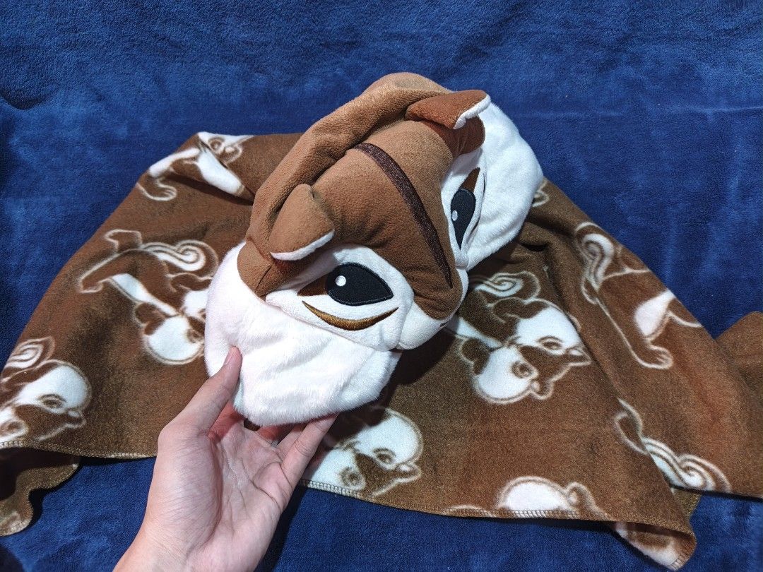 Chipmunk Animal Hooded Blanket Plush (Category: Bedding & Towels) located in Manila. Submitted by kirstentoyshub (Listing ID 1470011672, Image 2). Description: - Adorable chipmunk plush hooded blanket in cozy brown fleece - All-over cute chipmunk character print - Headrest easily folds out into a plush animal hood with large cheeks and embroidered eyes - Soft and warm material, ideal for travel or movie nights.