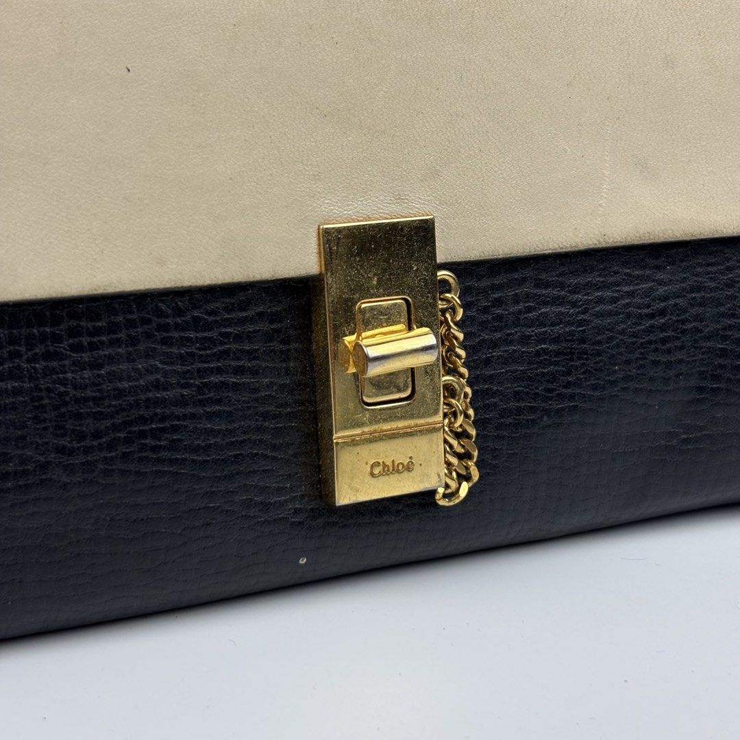 Chloe Drew Clutch Wallet (Category: Luxury Bags & Wallets) located in Quezon City. Submitted by 1106_collective (Listing ID 1470071806, Image 3). Description: Measurements (Inch) Width: 7.9” Height: 4.2” Depth: 0.5” Made in: Italy Condition: 8/10 Flaws: Signs of use, with dirt and paint stains .