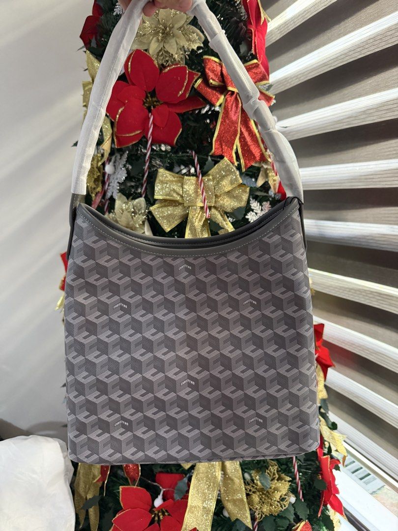 Christy Ng Alesso Medium (Category: Shoulder Bags) located in Manila. Submitted by maryjoremf13085 (Listing ID 1470002892, Image 2). Description: - Condition: Brand new, unused with handle protective wrappings intact - Design: Stylish geometric print with contrast black trim on top and base - Features: Secure top zipper closure and structured base panel to keep the bag upright - Variants: 3 options available, including one with bold 'Christy' whi