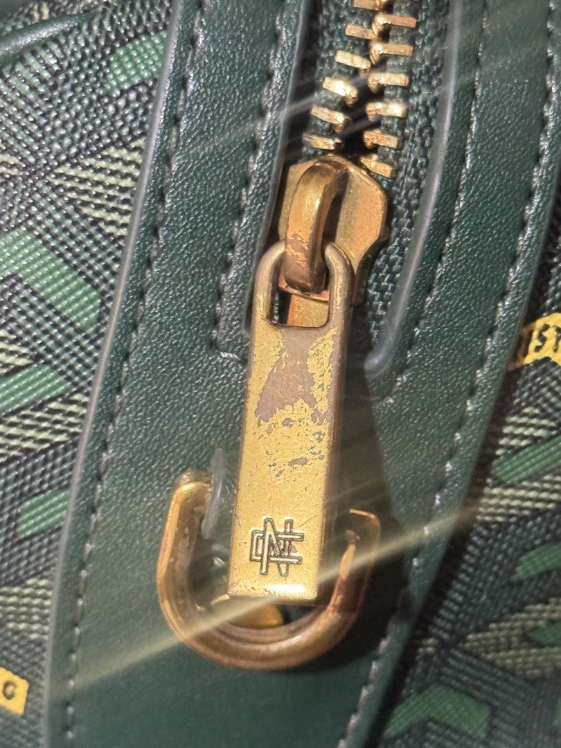 Christy Ng Enzo Mini Duffle Bag Version 2 Emerald Green (Category: Luxury Bags & Wallets) located in Manila. Submitted by yaz.maminta (Listing ID 1470028058, Image 2). Description: - Brand: ORIGINAL Christy Ng - Style: Enzo Mini Duffle Bag Version 2 - Color: Emerald Green - Design: All-over geometric pattern with small logo accents, structured top handle, and luxury gold-toned hardware - Closure: Dual zip closure - Capacity: Compact size, ideal f