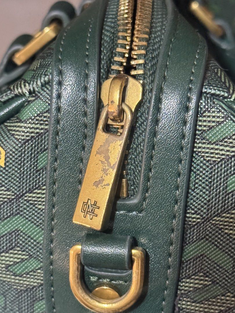 Christy Ng Enzo Mini Duffle Bag Version 2 Emerald Green (Category: Luxury Bags & Wallets) located in Manila. Submitted by yaz.maminta (Listing ID 1470028058, Image 3). Description: - Brand: ORIGINAL Christy Ng - Style: Enzo Mini Duffle Bag Version 2 - Color: Emerald Green - Design: All-over geometric pattern with small logo accents, structured top handle, and luxury gold-toned hardware - Closure: Dual zip closure - Capacity: Compact size, ideal f