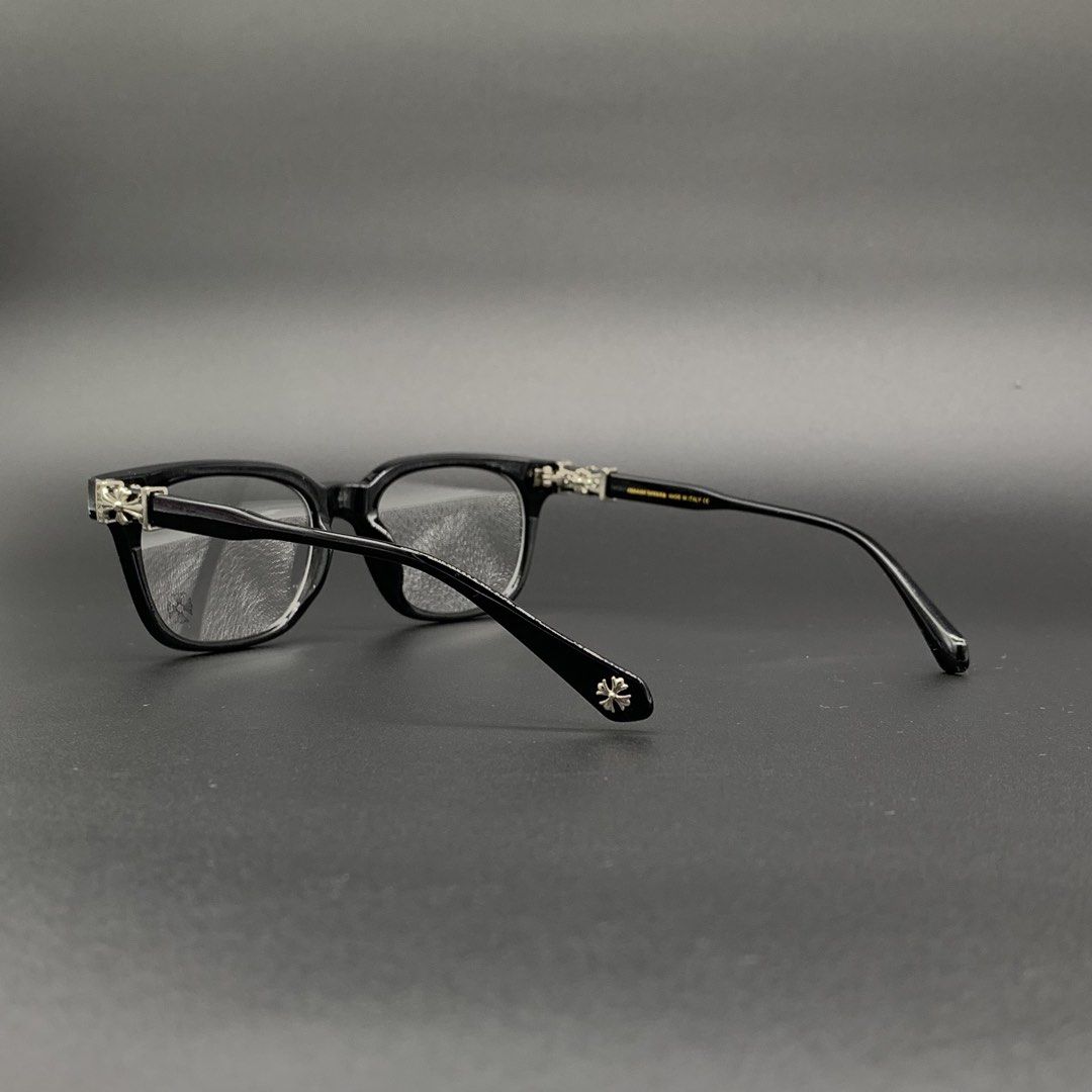 Chrome Hearts Black Eyeglasses Frame Model 2273 (Category: Sunglasses & Eyewear) located in Marikina City. Submitted by see.rich.be.rich (Listing ID 1470002092, Image 2). Description: Chrome Hearts black optical frames with distinctive silver cross hardware on the temples and hinge details. Model number 2273 stamped on the arm alongside size specifications 53-18-138. Clear demo lenses fitted with brand logo printed on the glass. Classic square sh