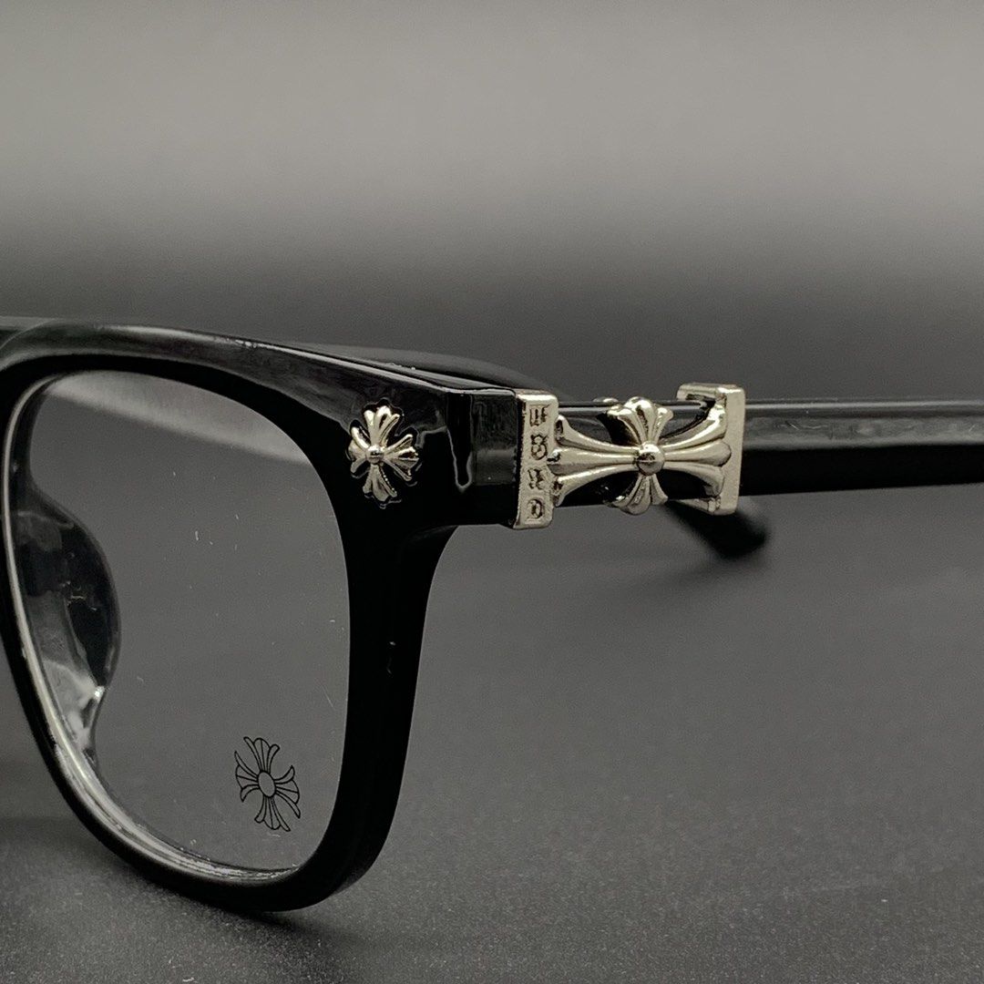 Chrome Hearts Black Eyeglasses Frame Model 2273 (Category: Sunglasses & Eyewear) located in Marikina City. Submitted by see.rich.be.rich (Listing ID 1470002092, Image 3). Description: Chrome Hearts black optical frames with distinctive silver cross hardware on the temples and hinge details. Model number 2273 stamped on the arm alongside size specifications 53-18-138. Clear demo lenses fitted with brand logo printed on the glass. Classic square sh