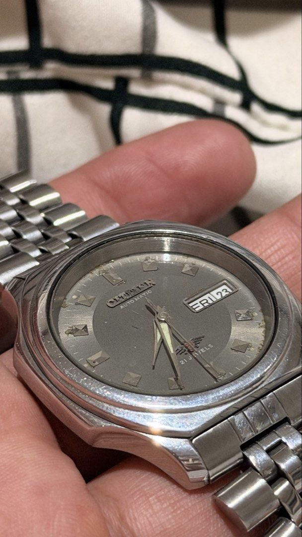 Citizen Automatic Silver Stainless Steel Watch with Grey Dial (Category: Men's Watches) located in Cavite. Submitted by bwesita (Listing ID 1470009468, Image 2). Description: - Brand/Model: Citizen Eagle 7 - Movement: Automatic - Japan Caliber: 8200 - Serial # 7D1533 - Patina Gray Dial and day-date display at 3 o’clock - 36mm - Open back case - Jubilee Bracelet - Replacement box - 8/10 Condition NOTE: Need some slight cleaning .