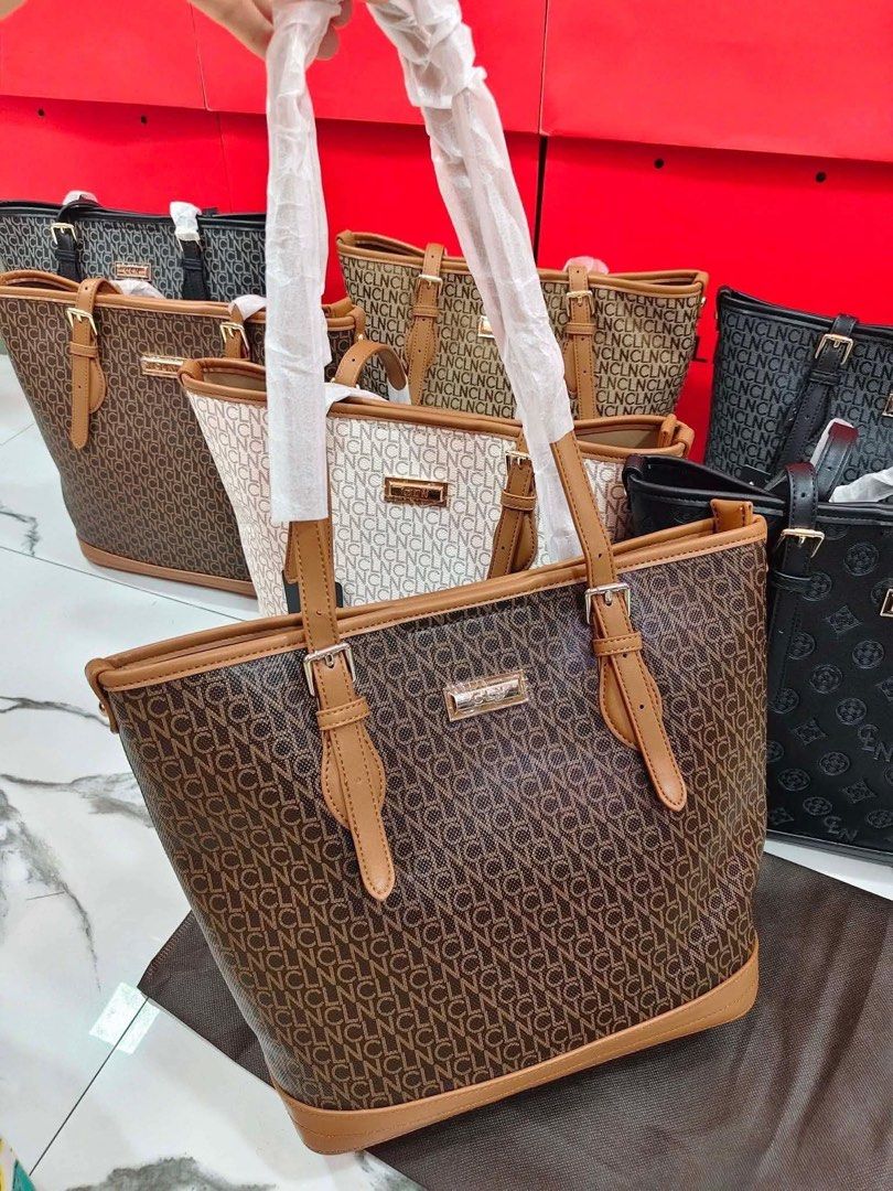 CLN Monogram Tote Bag Black (Category: Tote Bags) located in Manila. Submitted by zosia_smith (Listing ID 1470011217, Image 2). Description: - Brand: CLN - Color: Classic Black - Design: All-over debossed monogram pattern - Hardware: Gold-tone hardware with protective metal feet at the base - Straps: Dual shoulder straps (wrapped in protective paper) - Closure: Secure zip top closure - Interior: Lined with a convenient zippered pocket and CLN bra