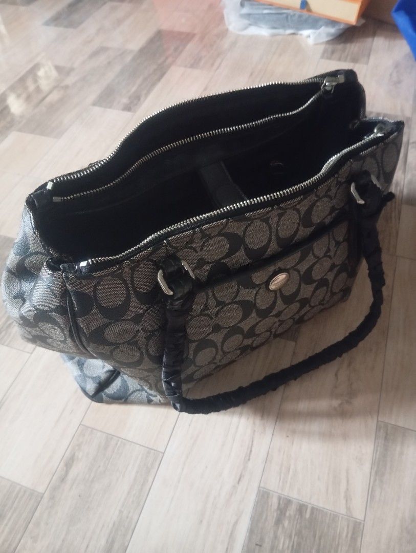 Coach Black C Pattern Coated Canvas Double Handle Triple Entry Tote Bag (Category: Luxury Bags & Wallets) located in Binangonan. Submitted by lalamo_collection (Listing ID 1470019812, Image 1). Description: - Brand: Coach - Design: Signature C jacquard pattern in black and grey - Compartments: The bag has open pockets on the front and back of the exterior. The interior is divided into three compartments - Details: Premium dark leather trim - Inte