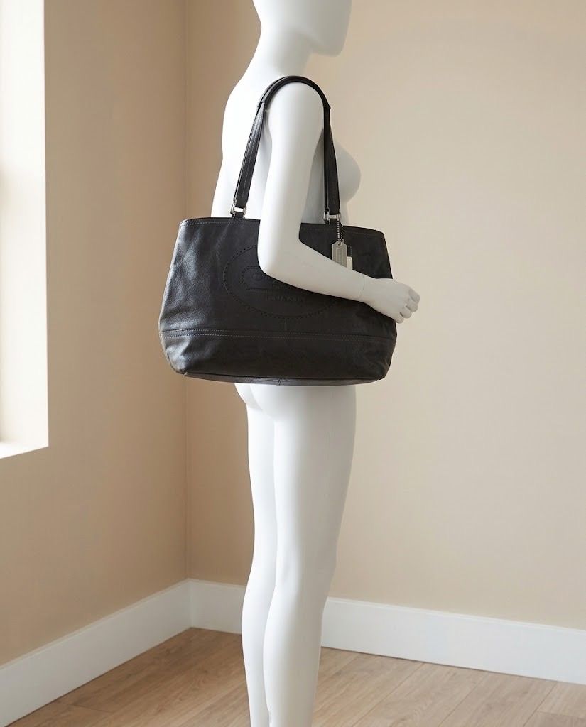 COACH HAMPTON BLACK LEATHER BAG (Category: Shoulder Bags) located in Marikina City. Submitted by minimalistmanila (Listing ID 1469958752, Image 1). Description: -New Authentic Coach Hampton perforated black leather tote bag. Features embossed logo, hang tag, double handles and a zippered main compartment. Perfect for everyday use. -Bought in Coach store in Singapore years ago but never used. Comes with authenticity card, bag tags, price tag and d