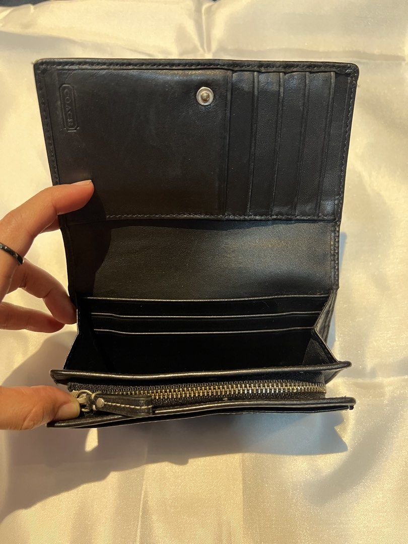 Coach Black Signature C Canvas Leather Medium Wallet (Category: Luxury Bags & Wallets) located in Manila. Submitted by ghengdhoze (Listing ID 1470059135, Image 3). Description: - Brand: Coach - Color: Black (Signature C canvas with black leather trim) - Hardware: Silver-tone - Closure: Snap button strap - Interior: Multiple card slots, bill compartment, and zippered coin pocket - Size: Compact, fits easily into any handbag - Condition: Clean inte