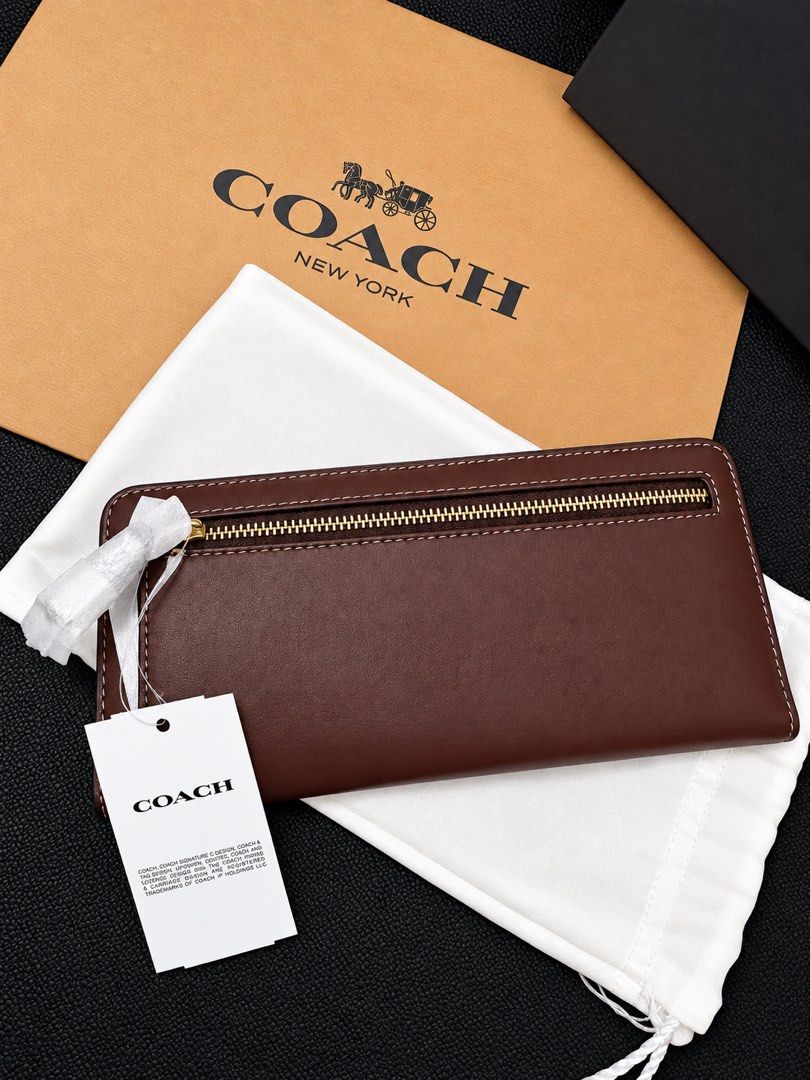 Coach Brass/Maple Leather Long Wallet with Gold C Logo (Category: Luxury Bags & Wallets) located in Lipa City. Submitted by soojinkmh (Listing ID 1470103427, Image 3). Description: COACH Essential Slim Wallet – Brass/Maple RFS: Decluttering / Not being used Price: ₱13,000 (Slightly negotiable) Condition: Brand New Details: * Material: Refined calf leather * Gold Coach “C” logo * Snap closure * 12 credit card slots * Full-length bill compartments 
