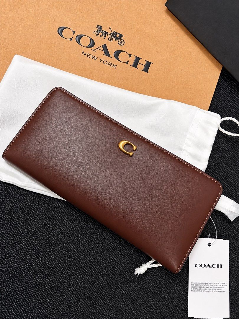 Coach Brass/Maple Leather Long Wallet with Gold C Logo (Category: Luxury Bags & Wallets) located in Lipa City. Submitted by soojinkmh (Listing ID 1470103427, Image 2). Description: COACH Essential Slim Wallet – Brass/Maple RFS: Decluttering / Not being used Price: ₱13,000 (Slightly negotiable) Condition: Brand New Details: * Material: Refined calf leather * Gold Coach “C” logo * Snap closure * 12 credit card slots * Full-length bill compartments 