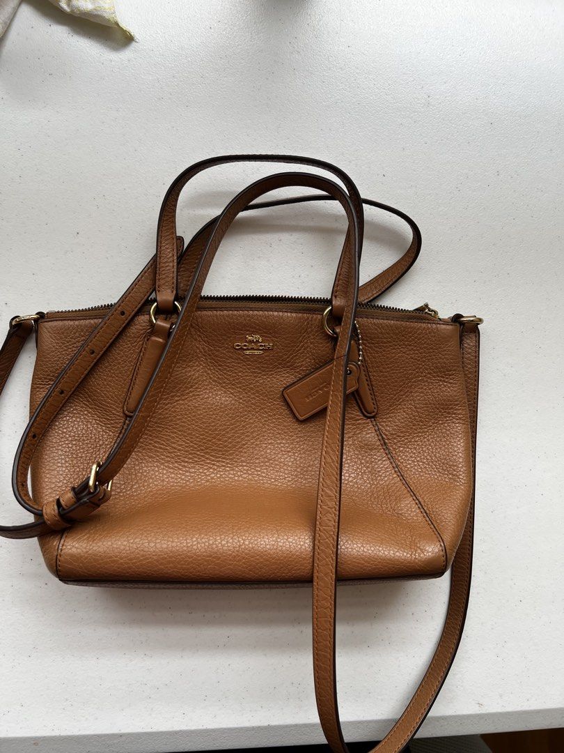 Coach Brown Leather Handbag Crossbody (Category: Luxury Bags & Wallets) located in Naga. Submitted by siennah_loyce (Listing ID 1469983882, Image 3). Description: Length: 8.75 inches (~22 cm) Height: 5.5 inches (~14 cm) Width/Depth: 3.0 inches (~7.5 cm) Sf shouldered by Buyer MOP: BDO/GCASH .