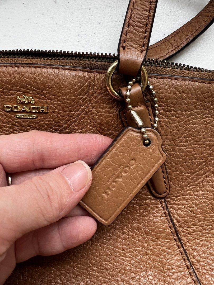Coach Brown Leather Handbag Crossbody (Category: Luxury Bags & Wallets) located in Naga. Submitted by siennah_loyce (Listing ID 1469983882, Image 2). Description: Length: 8.75 inches (~22 cm) Height: 5.5 inches (~14 cm) Width/Depth: 3.0 inches (~7.5 cm) Sf shouldered by Buyer MOP: BDO/GCASH .