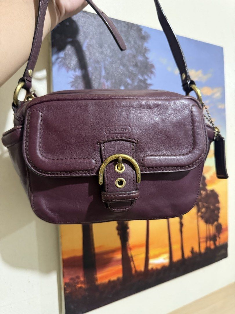Coach Campbell Leather Camera Crossbody Bag (Category: Cross-body Bags) located in Quezon City. Submitted by vianca13 (Listing ID 1470034975, Image 1). Description: - Authentic Coach leather shoulder bag in a stunning rich purple - Compact camera bag silhouette with chic gold-tone hardware - Convenient front flap pocket featuring a stylish buckled strap detail - Secure zip-top closure opening to a clean fabric lining with inner creed patch - Comp