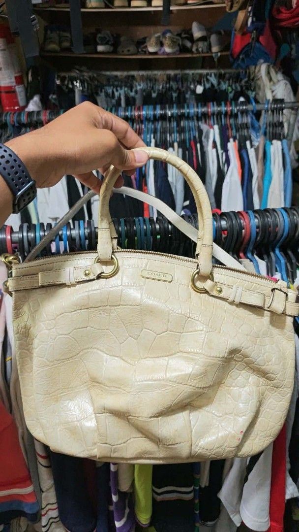 Coach Crocodile Embossed Leather Handbag Cream (Category: Luxury Bags & Wallets) located in Isulan. Submitted by jaysthrift (Listing ID 1470027602, Image 1). Description: - Brand: Coach - Color: Cream with light pink interior - Material: Crocodile embossed leather - Hardware: Gold-tone - Closure: Zip top - Strap: Dual top handles and detachable crossbody strap - Interior: Fabric lining with slip pockets and Coach leather creed patch (Serial: A137