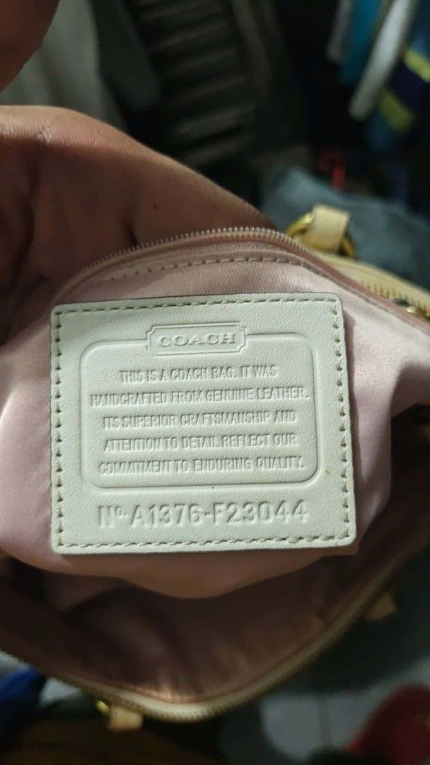 Coach Crocodile Embossed Leather Handbag Cream (Category: Luxury Bags & Wallets) located in Isulan. Submitted by jaysthrift (Listing ID 1470027602, Image 3). Description: - Brand: Coach - Color: Cream with light pink interior - Material: Crocodile embossed leather - Hardware: Gold-tone - Closure: Zip top - Strap: Dual top handles and detachable crossbody strap - Interior: Fabric lining with slip pockets and Coach leather creed patch (Serial: A137