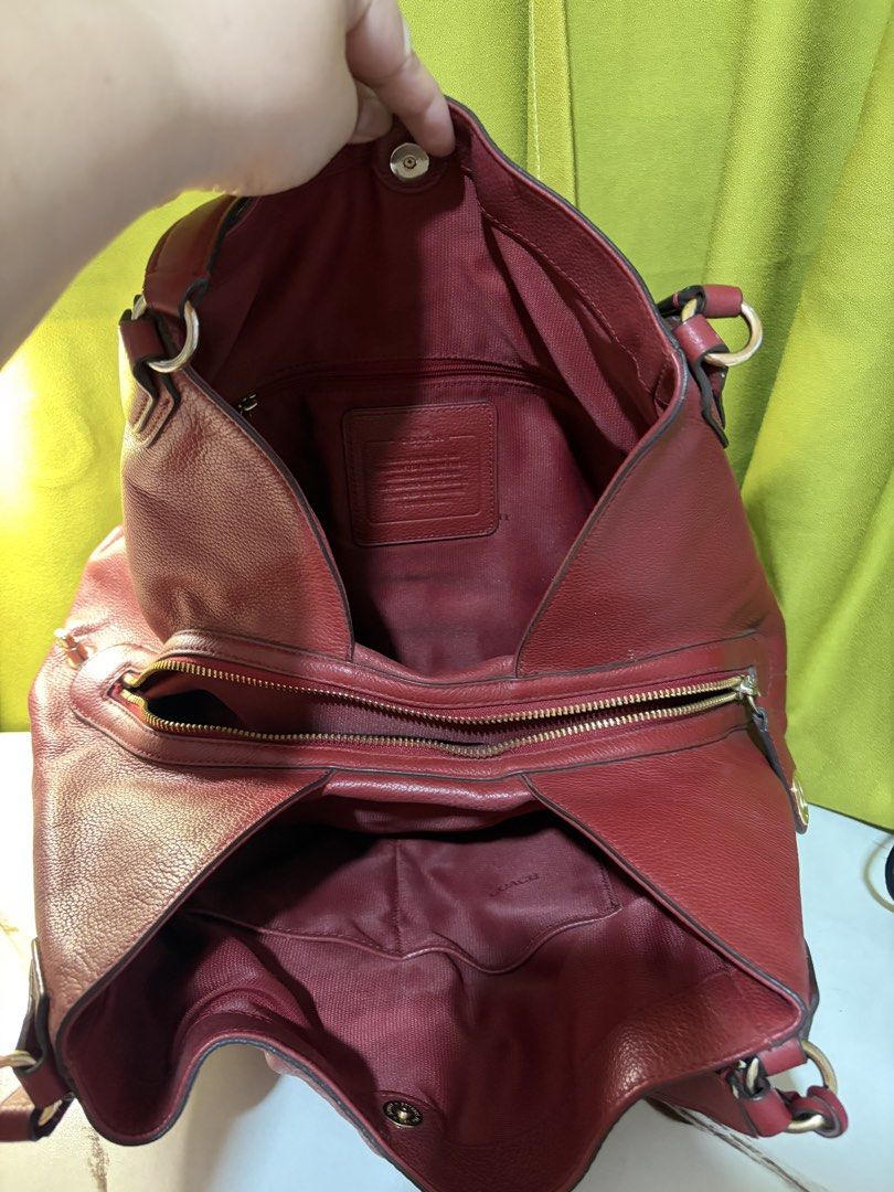 Coach Edie Shoulder Bag (Category: Shoulder Bags) located in Borongan. Submitted by charmspreloveddd (Listing ID 1470022060, Image 3). Description: - Authentic Coach red pebble leather shoulder bag - Style Number: 33547 - Elegant gold-tone hardware and iconic oval Coach New York logo plaque - Dual top handles and secure top zip closure - Spacious interior lined in red fabric with functional zip and slip pockets - L:35cm (bottom) 23cm (top) W:14cm
