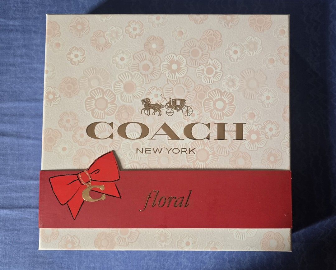 Coach Floral Eau De Parfum Gift Set (Category: Fragrance & Deodorants) located in Quezon City. Submitted by impdc1130 (Listing ID 1470132758, Image 2). Description: - Brand new Coach Floral fragrance gift set in original floral box with red ribbon - Includes full-size perfume spray and scented body lotion - Comes with a handy travel-size spray for on-the-go - Features a stylish black Coach pouch with gold star zipper pull - All items neatly tucke