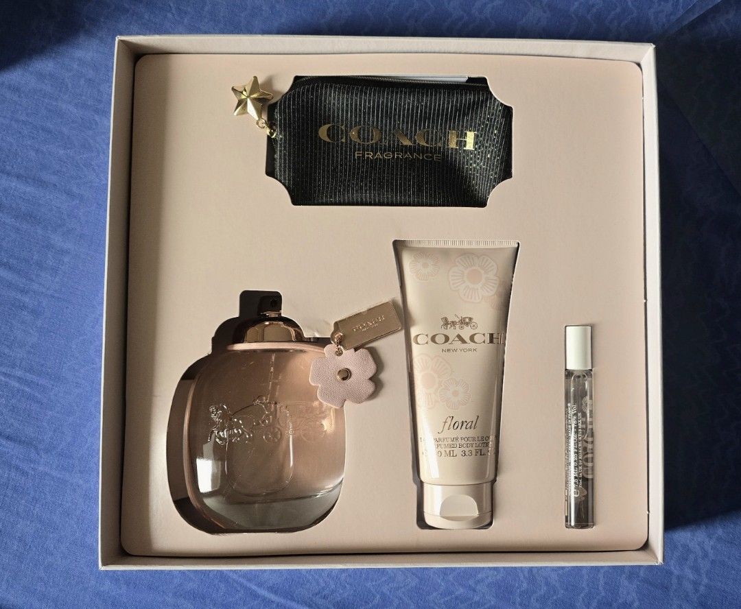 Coach Floral Eau De Parfum Gift Set (Category: Fragrance & Deodorants) located in Quezon City. Submitted by impdc1130 (Listing ID 1470132758, Image 1). Description: - Brand new Coach Floral fragrance gift set in original floral box with red ribbon - Includes full-size perfume spray and scented body lotion - Comes with a handy travel-size spray for on-the-go - Features a stylish black Coach pouch with gold star zipper pull - All items neatly tucke