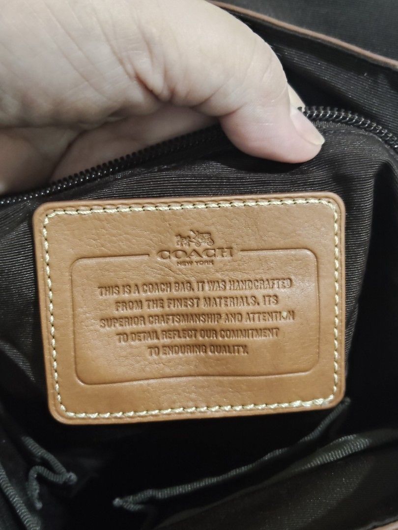 Coach Leather Messenger Bag Brown Blue Strap (Category: Sling Bags) located in Cebu City. Submitted by almzcorner (Listing ID 1469969879, Image 3). Description: - Authentic Coach brown leather messenger bag - Stylish navy and cream webbed strap - Flap closure with secure magnetic snap - Interior features a zipper pocket, slip pockets, and clean fabric lining - Signature leather story patch inside - Silver hardware stamped with the Coach logo - Co