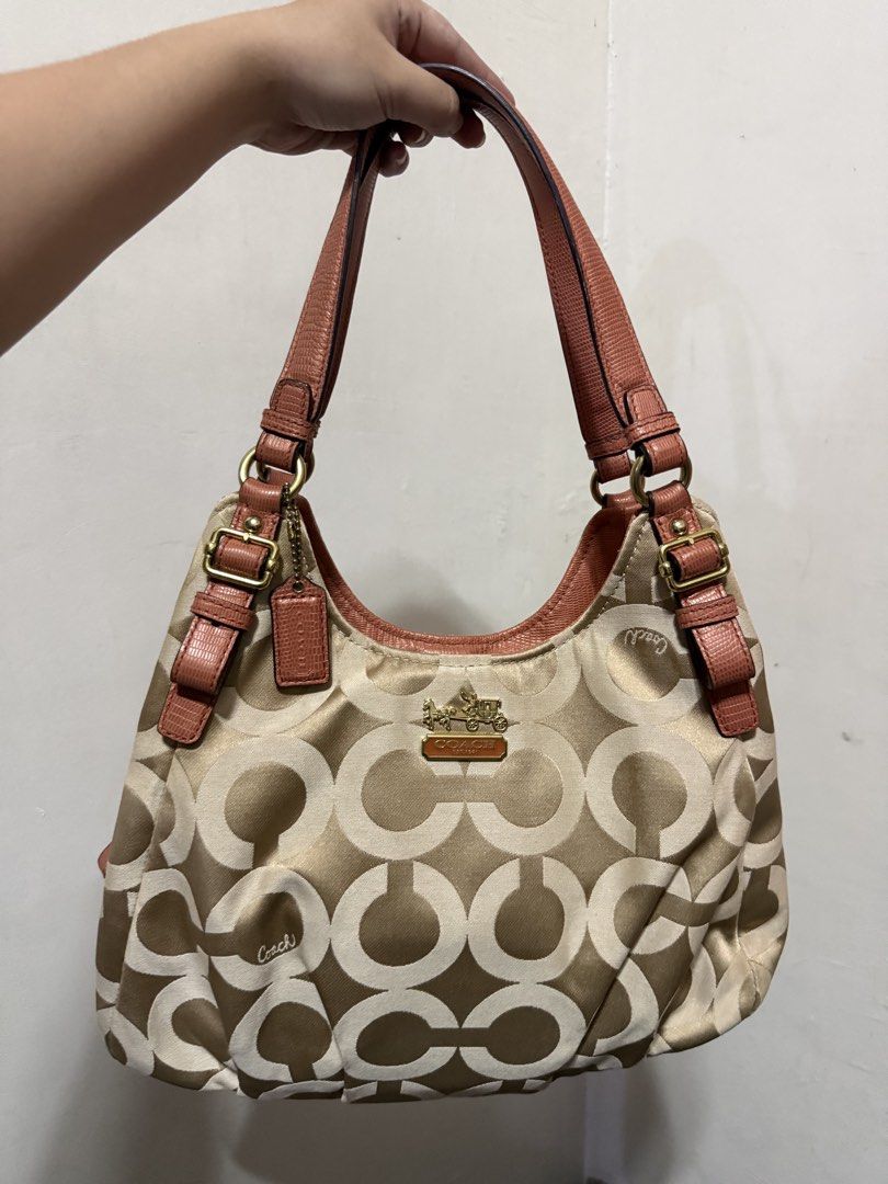 Coach Madison (Category: Luxury Bags & Wallets) located in Manila. Submitted by lovebagsbydalle (Listing ID 1470102006, Image 1). Description: - Brand: Coach - Material: Signature C jacquard fabric with pink textured leather trim - Color: Khaki, Gold, and Pink - Hardware: Gold-tone with front metal carriage logo plaque and matching hangtag - Straps: Double shoulder straps with adjustable side buckles - Interior: Roomy main compartment for daily e