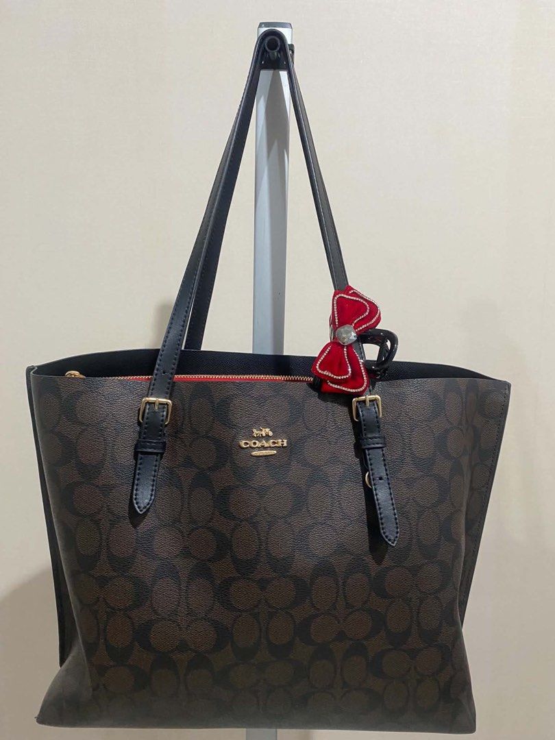 Coach Mollie Tote Bag (Category: Luxury Bags & Wallets) located in Quezon City. Submitted by vintagepurse.vault (Listing ID 1470118439, Image 1). Description: Coach Mollie Tote Bag (AVAILABLE) Condition: 9/10 No issues ₱4,000 Dm to purchase. ❤️.