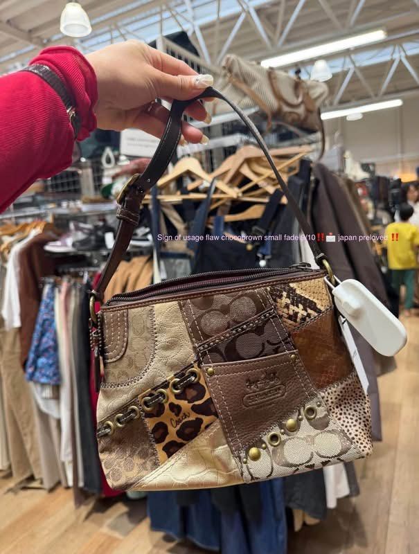 Coach Patchwork Handbag (Category: Luxury Bags & Wallets) located in Lucena. Submitted by hyyy.ellie_ (Listing ID 1469993690, Image 1). Description: - Authentic Coach patchwork shoulder bag imported from Japan - Unique mix of monogram canvas, leopard print calf hair, snakeskin print, and metallic leather - Features a brown leather patch with the embossed Coach logo and single brown strap - Vibrant pink satin lining with an interior slip pocket an