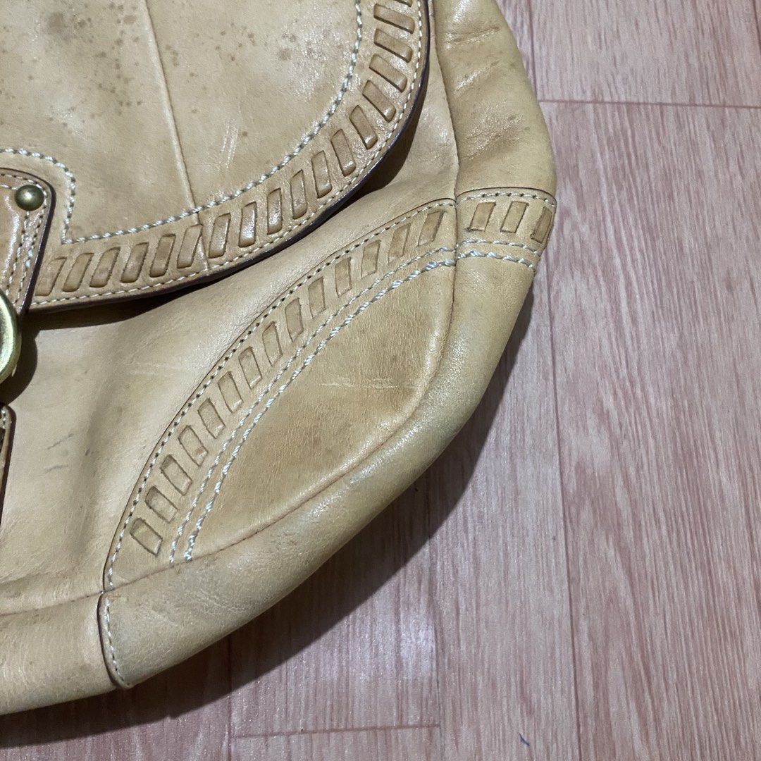 Coach Tan Leather Shoulder Bag with Braided Strap (Category: Luxury Bags & Wallets) located in Manila. Submitted by 5treetw3ar (Listing ID 1470069242, Image 3). Description: - Brand: Coach - Material: Premium tan leather with brass-tone hardware - Design: Contrast white stitching, decorative inset panels, and embossed brand hangtag - Details: Unique braided handle and secure buckle closure - Storage: Handy exterior back pocket for quick access - 