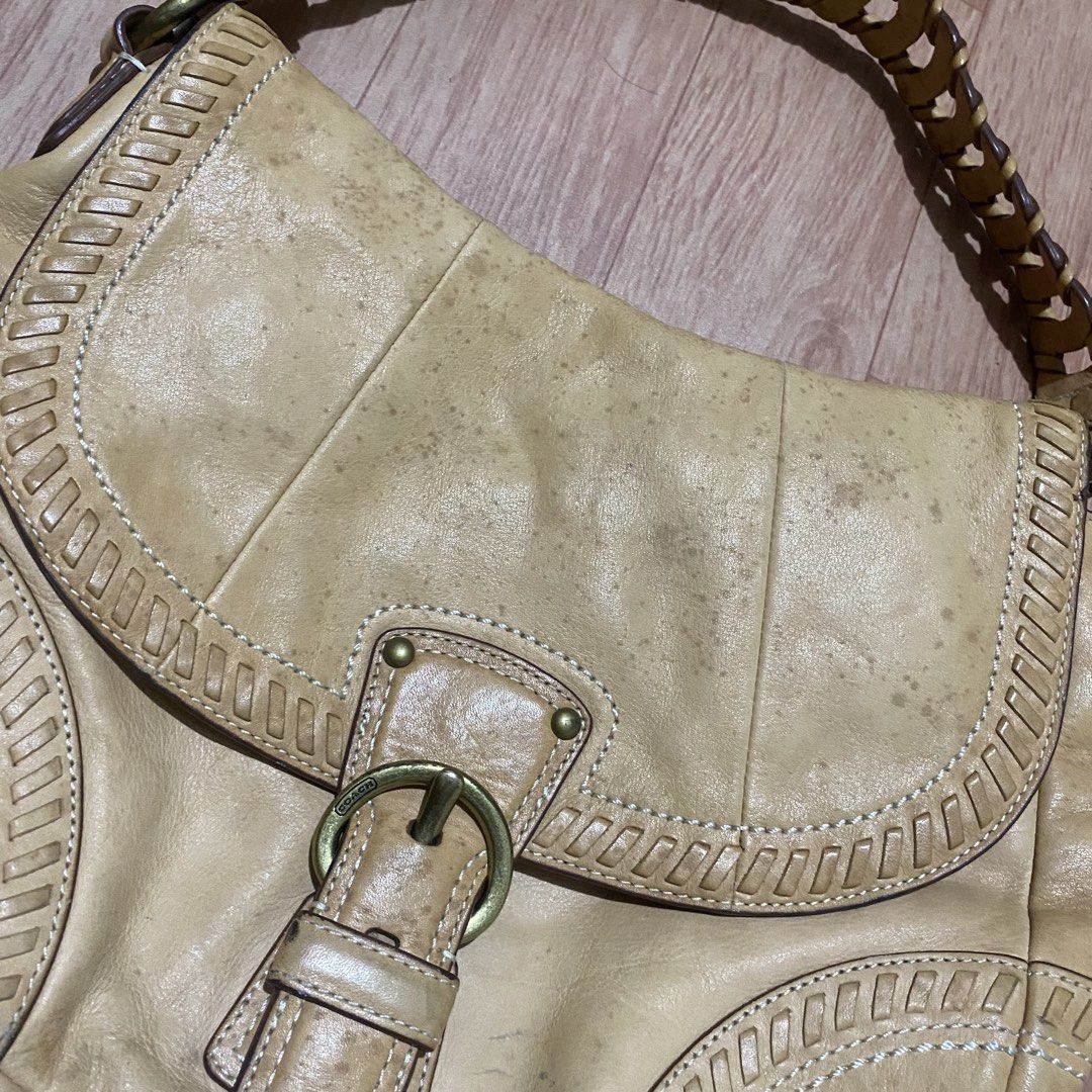 Coach Tan Leather Shoulder Bag with Braided Strap (Category: Luxury Bags & Wallets) located in Manila. Submitted by 5treetw3ar (Listing ID 1470069242, Image 2). Description: - Brand: Coach - Material: Premium tan leather with brass-tone hardware - Design: Contrast white stitching, decorative inset panels, and embossed brand hangtag - Details: Unique braided handle and secure buckle closure - Storage: Handy exterior back pocket for quick access - 