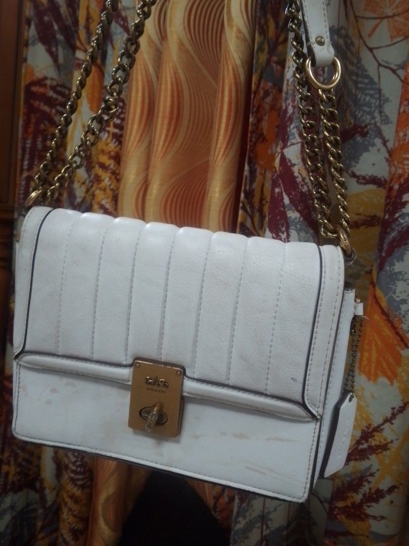 Coach White Quilted Hutton bundle (Category: Luxury Bags & Wallets) located in Manila. Submitted by annemil_1984 (Listing ID 1470110333, Image 1). Description: - Brand: Coach 100 percent orig - Material: White quilted leather with brown suede-like interior lining - Hardware: Gold-tone chain strap need deep cleaning and turnlock closure - Compartments: One interior zipper pocket - Inclusions: Matching hanging leather tag and interior brand tag - C