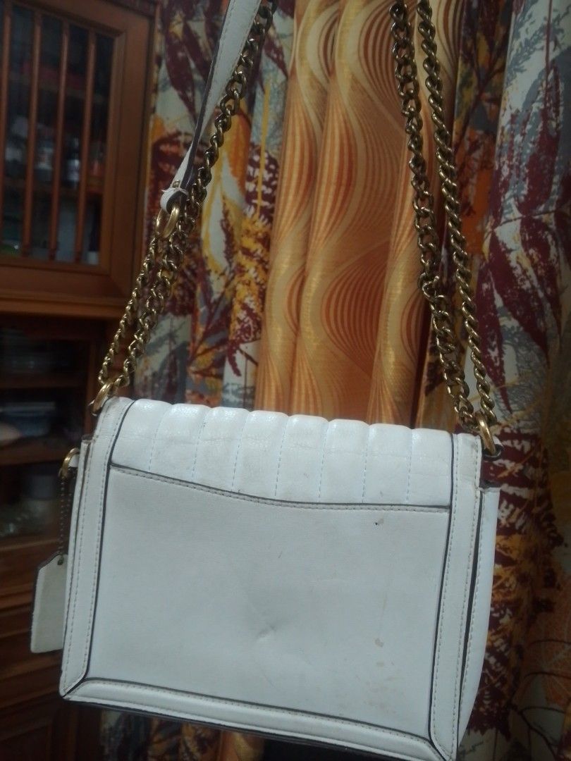 Coach White Quilted Hutton bundle (Category: Luxury Bags & Wallets) located in Manila. Submitted by annemil_1984 (Listing ID 1470110333, Image 3). Description: - Brand: Coach 100 percent orig - Material: White quilted leather with brown suede-like interior lining - Hardware: Gold-tone chain strap need deep cleaning and turnlock closure - Compartments: One interior zipper pocket - Inclusions: Matching hanging leather tag and interior brand tag - C